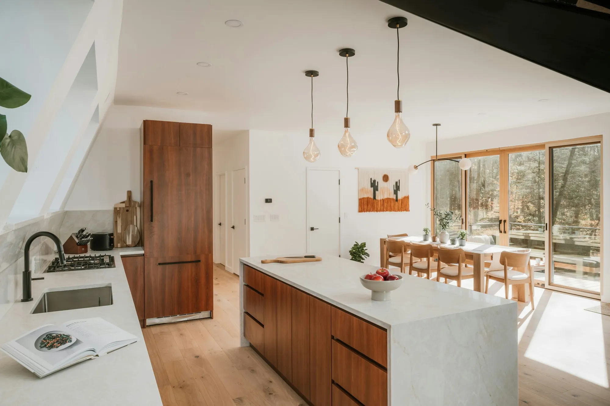 Walnut kitchen island with a white stone top