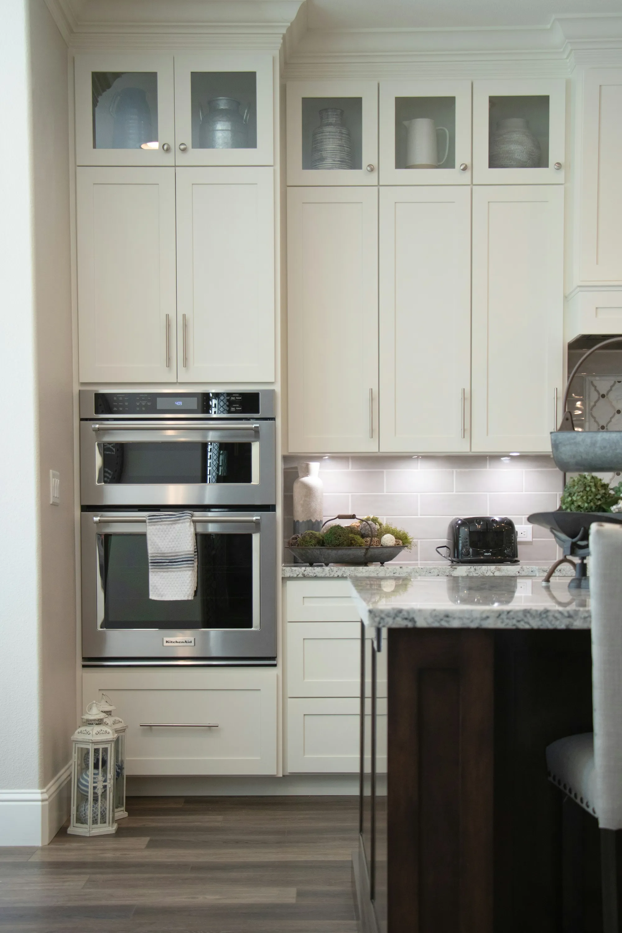 White cabinets with a built-in oven and microwave