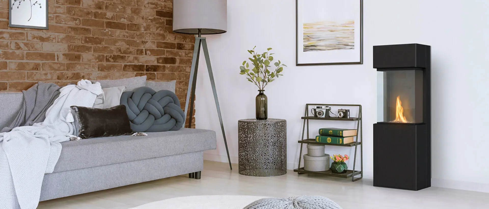 Planika Arcticon fireplace in a living room with a brick wall