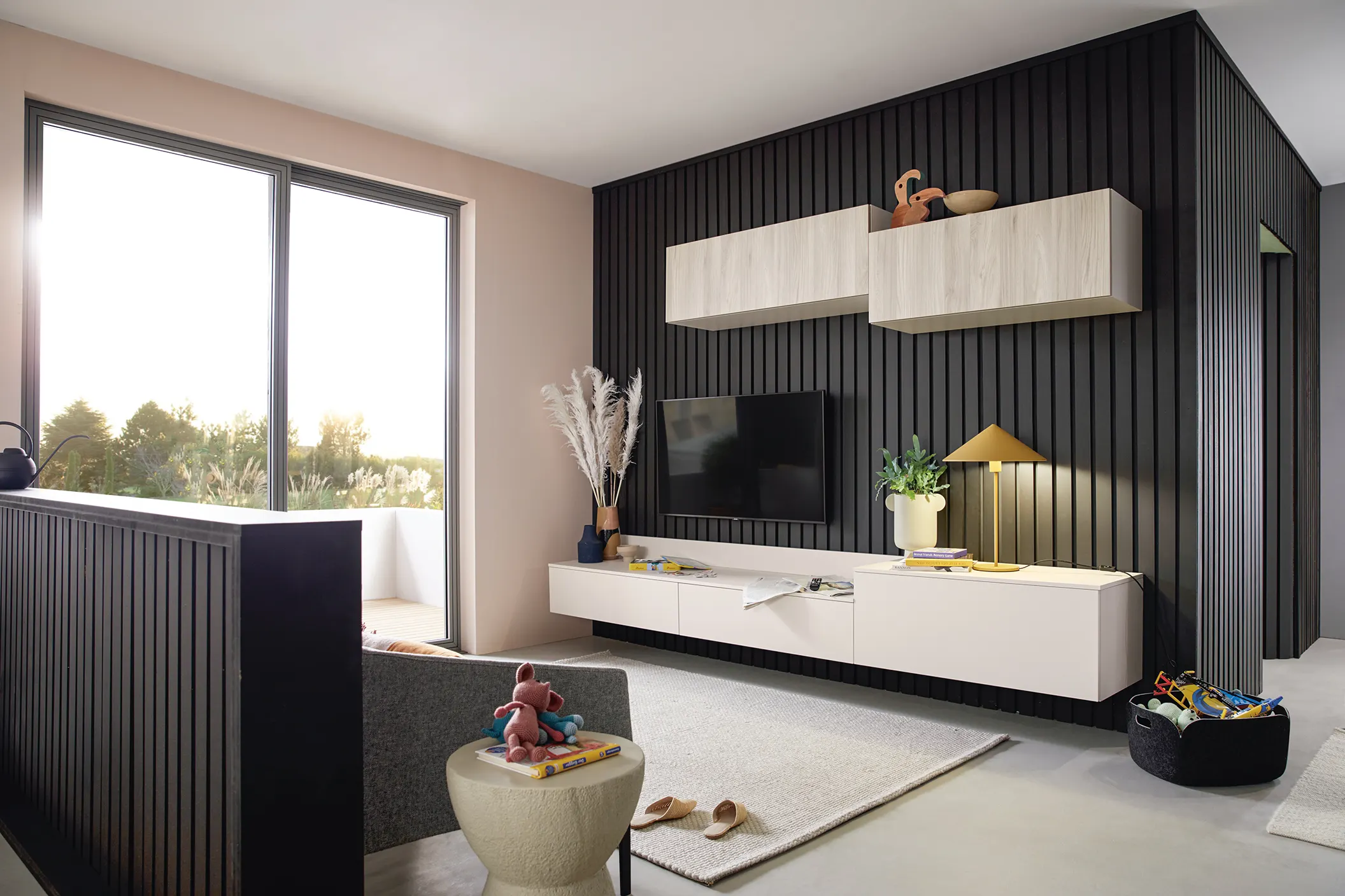 Slatted dark media wall with floating white units