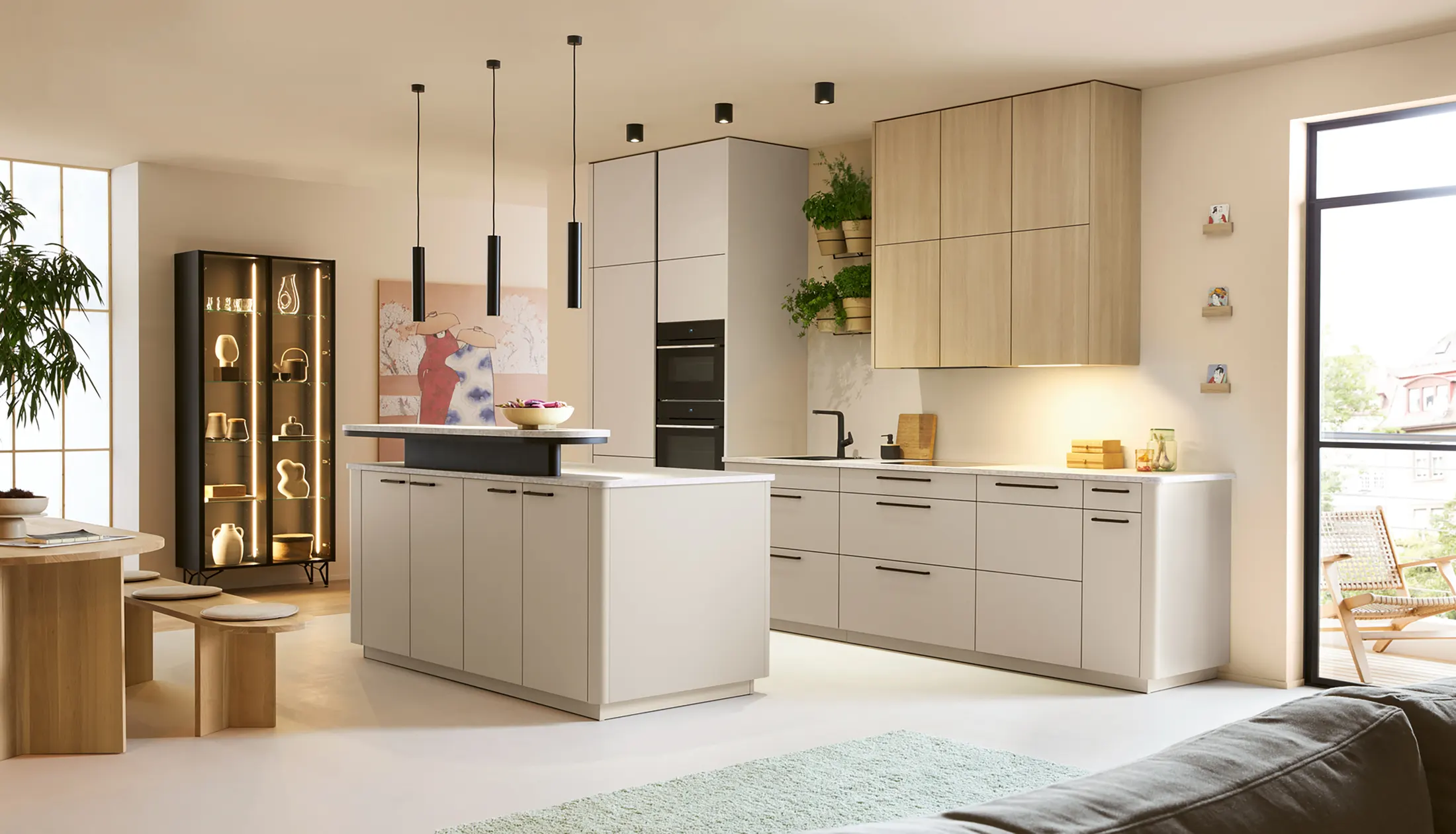 Open-plan kitchen and dining space with timber table