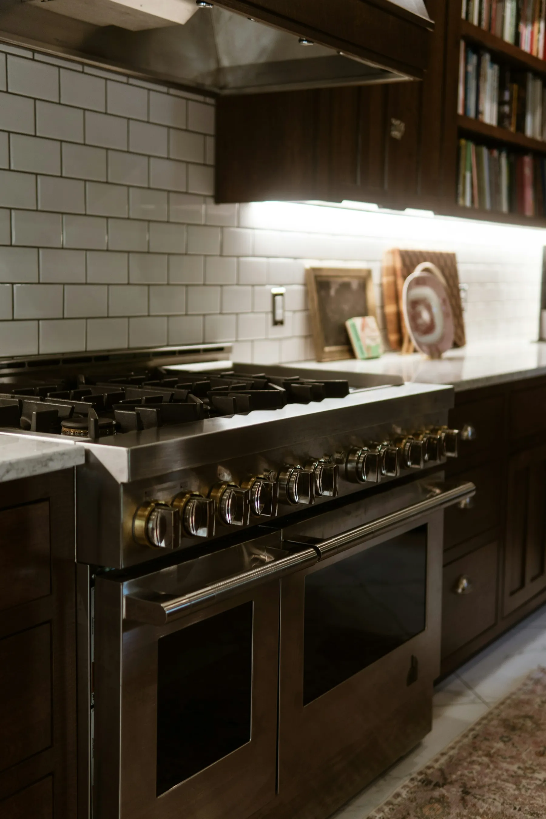 Professional-style range cooker with gas burners beside a white worktop
